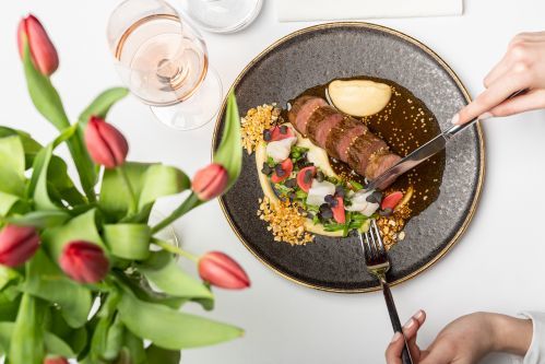 Roasted mangalica pork tenderloin, smoked bacon, parsley root puree, snow pea ragout, fermented radish at Café Liszt
